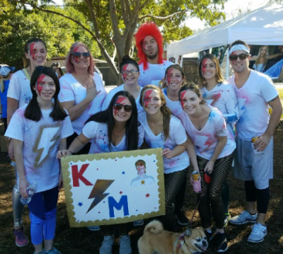 Photo of the KSM staff dressed as David Bowie while giving back to the community.
