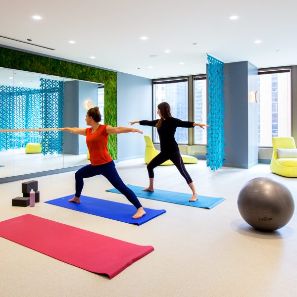 Image of two people doing yoga in the KSM gym.